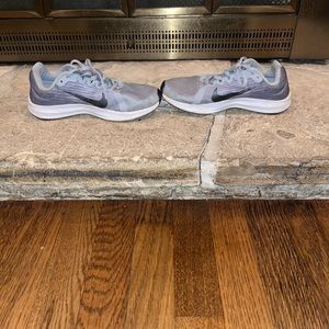 Black and grey downshifter  Nikes size 6